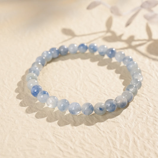 Blue crystal beaded bracelet with gold-tone spacers, shown in 6 mm and 8 mm options — Indigo Mist Crystal Bracelet by Glazenya.