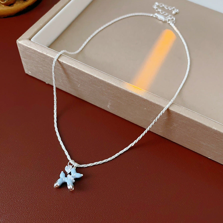 Silver-tone necklace and stud earrings with pastel blue balloon-dog charms — Blue Pup Pendant & Earrings Set.