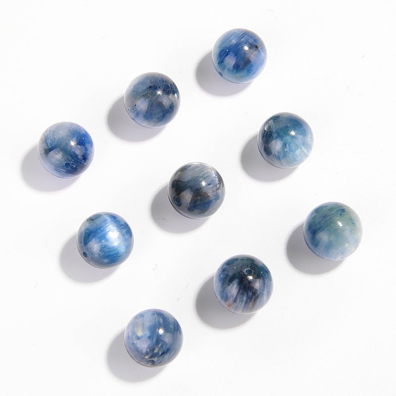 Natural blue kyanite round beads showing cat’s-eye sheen and striations — Sea-Squall Gaze (8–12 mm).
