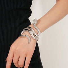 Serpent Luxe Cuff bracelet in gold and silver with rhinestone snake design