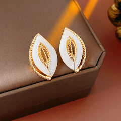 Leaf-shaped stud earrings with gold outline and white enamel – Golden Leaf Elegance Stud Earrings.