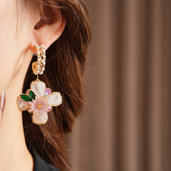Romantic floral statement earrings with pink blossoms, imitation pearls, and enamel petals — Blossom Pearl Garden Earrings.