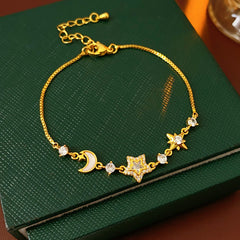 Lunar Starlight Charm Bracelet with crescent moon and star motifs on gold-tone chain – Glazenya