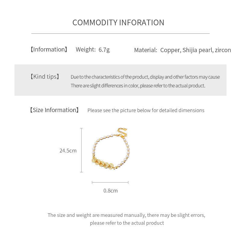 Gold link and pearl chain bracelet with zircon accents on green velvet background – Celestial Pearl Chain Bracelet by Glazenya