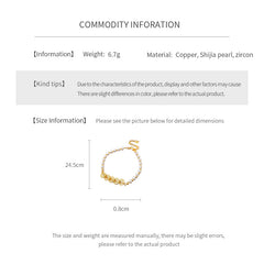 Gold link and pearl chain bracelet with zircon accents on green velvet background – Celestial Pearl Chain Bracelet by Glazenya