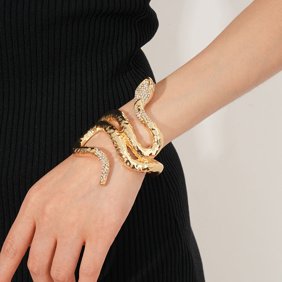 Serpent Luxe Cuff bracelet in gold and silver with rhinestone snake design
