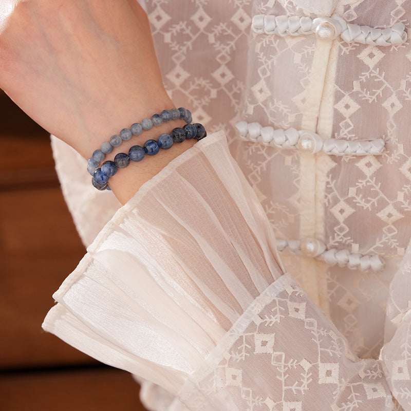 Blue crystal beaded bracelet with gold-tone spacers, shown in 6 mm and 8 mm options — Indigo Mist Crystal Bracelet by Glazenya.