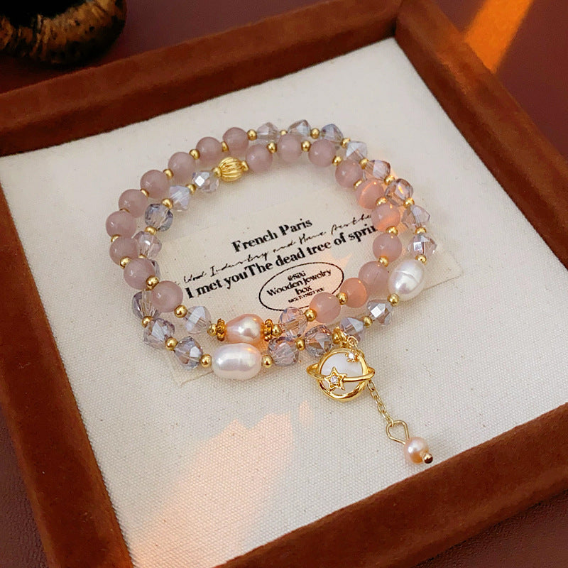 Celestial Cat’s Eye Bracelet double strand with cat’s-eye stones, freshwater pearls, crystal beads and gold planet charm