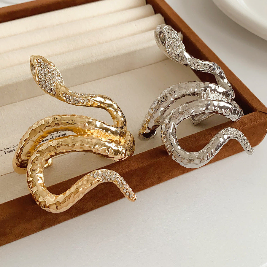 Serpent Luxe Cuff bracelet in gold and silver with rhinestone snake design