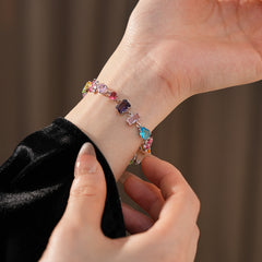 Iridescent Charm Bracelet in vivid multicolor zircon stones on silver-tone copper chain, elegant and lightweight luxury jewelry.