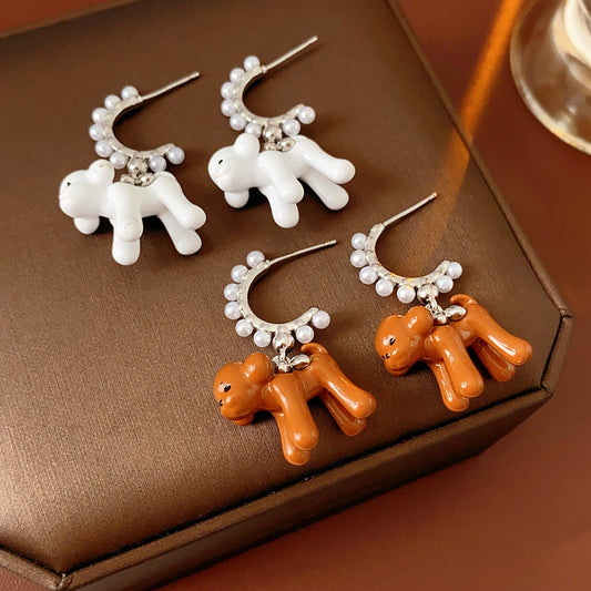 Pearl-adorned hoop earrings with dangling puppy charms in white and coffee — Pearl Pup Charm Hoops.