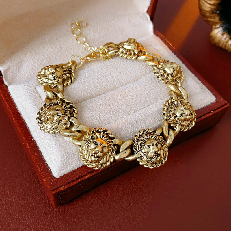 Vintage inspired lion medallion necklace and bracelet set in gold tone alloy with bold relief details