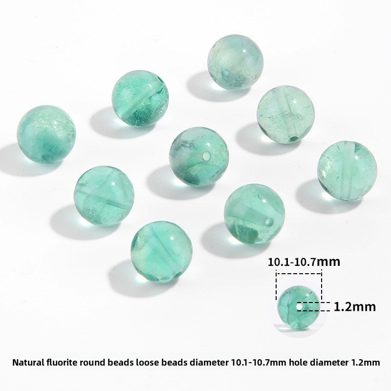 Watery mint-green fluorite round beads with translucent swirls — Mint Spring.