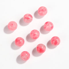 Pink chalcedony round beads, smooth polish, assorted 6–10 mm — Rosette Whisper.