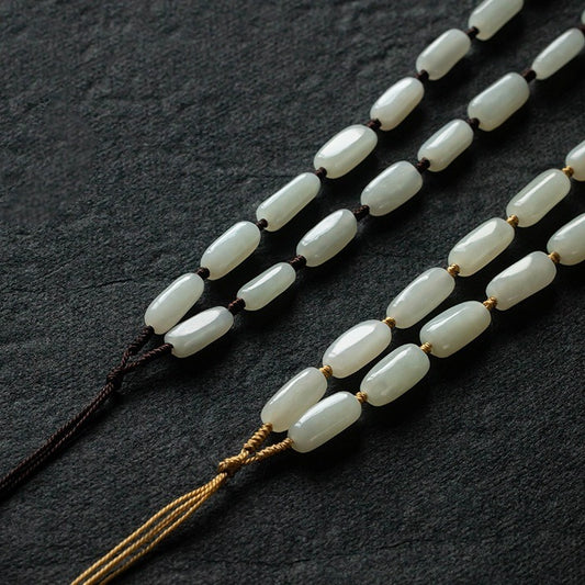 Handcrafted pendant cords wrapped with natural Hetian jade tube beads in light and dark brown — Snowglow Hetian Jade Pendant Cord.