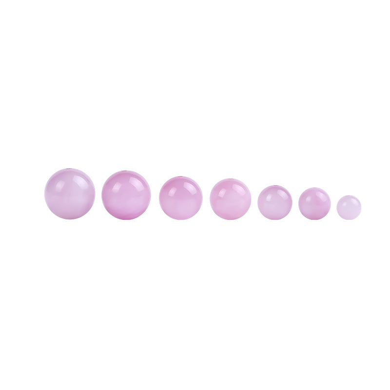 Pink-lilac kunzite round beads with silky glow, assorted 6–13 mm — Sakura Haze.