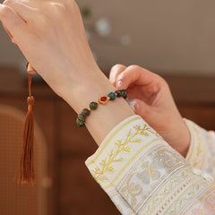 <div class="gz-desc">
  <p>Earthy and refined <strong>natural stone bracelet</strong> combining lush <strong>green ghost</strong> beads with smooth <strong>agate</strong>, accented by a warm red centerpiece and gold-tone spacers for a subtle touch of luxury.</p>

  <h3>Design Story</h3>
  <p>The <strong>Forest Ember Agate Bracelet</strong> evokes the calm of an ancient forest lit by a single ember. Mossy green tones bring grounding energy, while the red accent adds a gentle spark—balance between serenity an