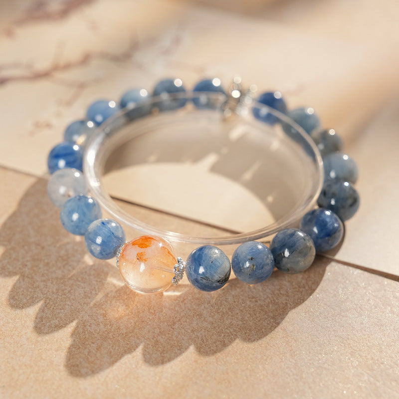 Natural blue crystal bracelet featuring a red flower bead centerpiece — Azure Dawn Crystal Bracelet by Glazenya.
