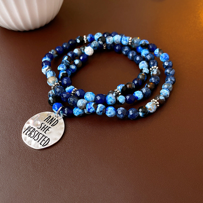 Multi-wrap blue agate bracelet with “AND SHE PERSISTED” charm — Ocean Resolve Bracelet by Glazenya.