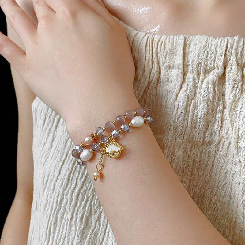 Celestial Cat’s Eye Bracelet double strand with cat’s-eye stones, freshwater pearls, crystal beads and gold planet charm