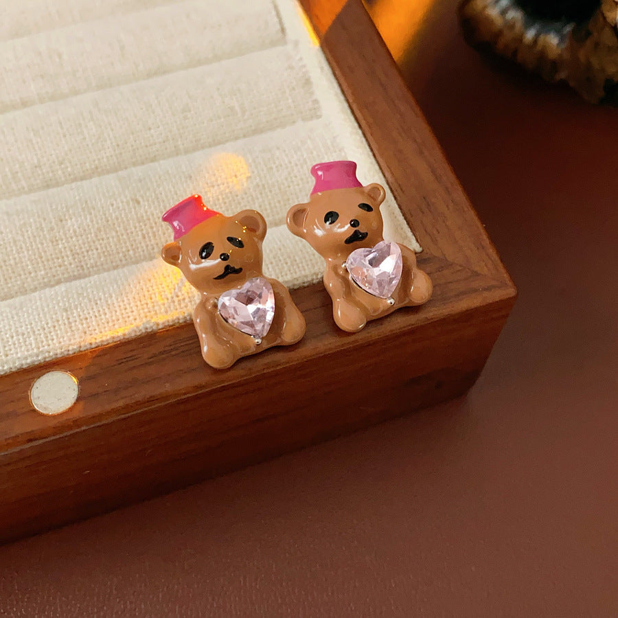 Silver-tone necklace with coffee teddy pendant and pink hat, matching teddy stud earrings with heart crystal — Sweetheart Teddy Crystal Jewelry.