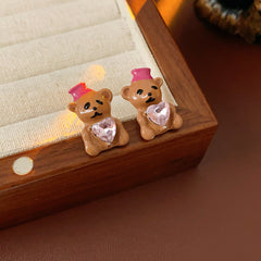 Silver-tone necklace with coffee teddy pendant and pink hat, matching teddy stud earrings with heart crystal — Sweetheart Teddy Crystal Jewelry.