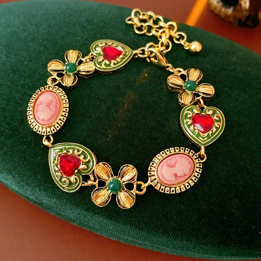 Royal Garden Cameo Set with gold-tone floral links, pink cameo ovals, green enamel hearts, and red stones