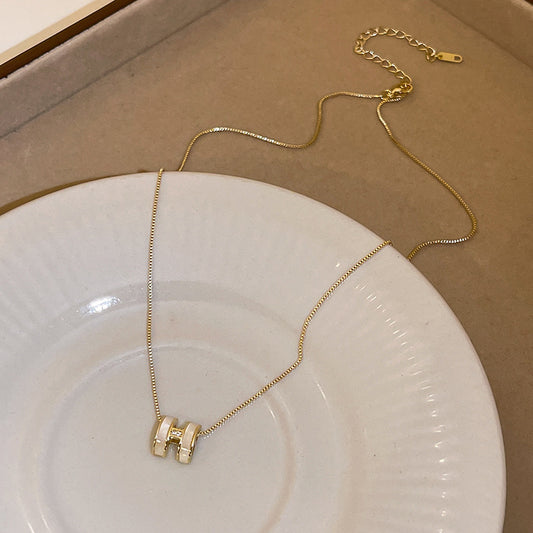 H initial jewelry series — necklace, ring, and earrings displayed individually