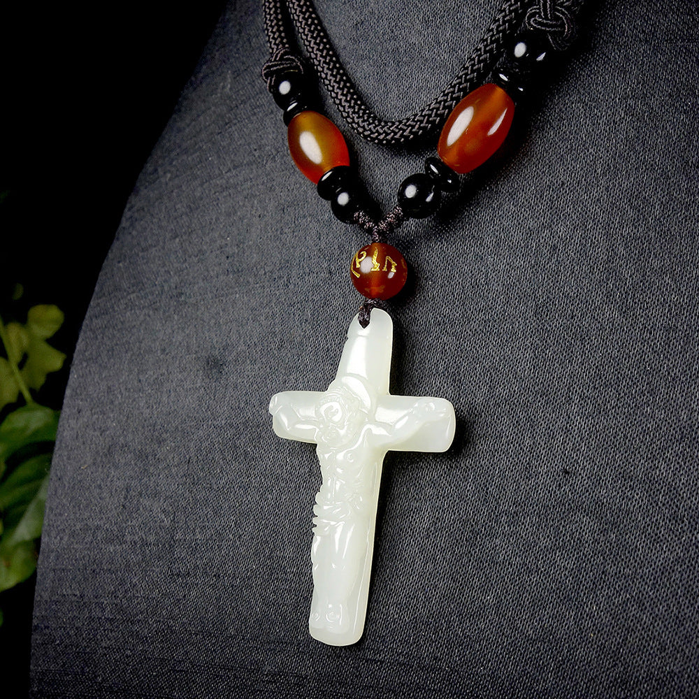 Hetian (nephrite) white jade crucifix pendant close-up – Sacred Light, 48×29×9 mm