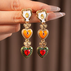 Enchanted Love Drop Earrings – vintage baroque heart-shaped dangle design with gold alloy and red crystal accents, 7cm length jewelry display