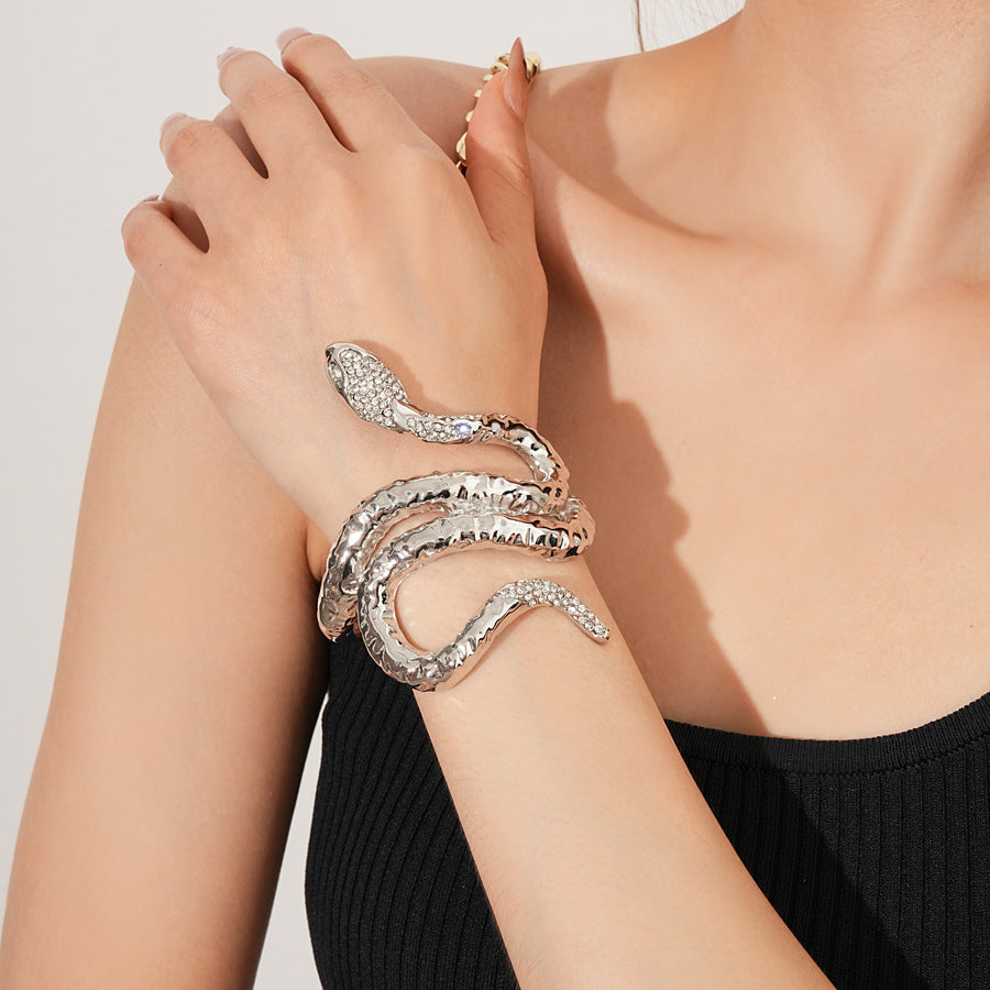 Serpent Luxe Cuff bracelet in gold and silver with rhinestone snake design