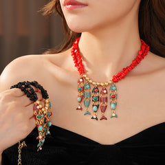 Statement necklace with articulated fishbone fringe, gold beads, and red or black chip strands — Kaleido Fishbone Fringe Necklace.