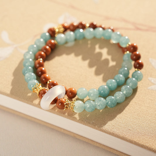 A double-wrap bracelet of sea blue and brown chalcedony beads, embellished with white rings - Dual-Tone Chalcedony Double-Wrap Bracelet.