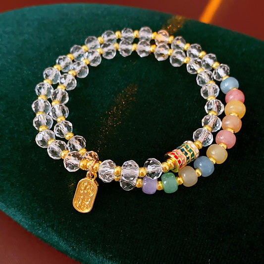 Double-layer dopamine crystal bracelet with clear crystals and colorful stone beads on green velvet background