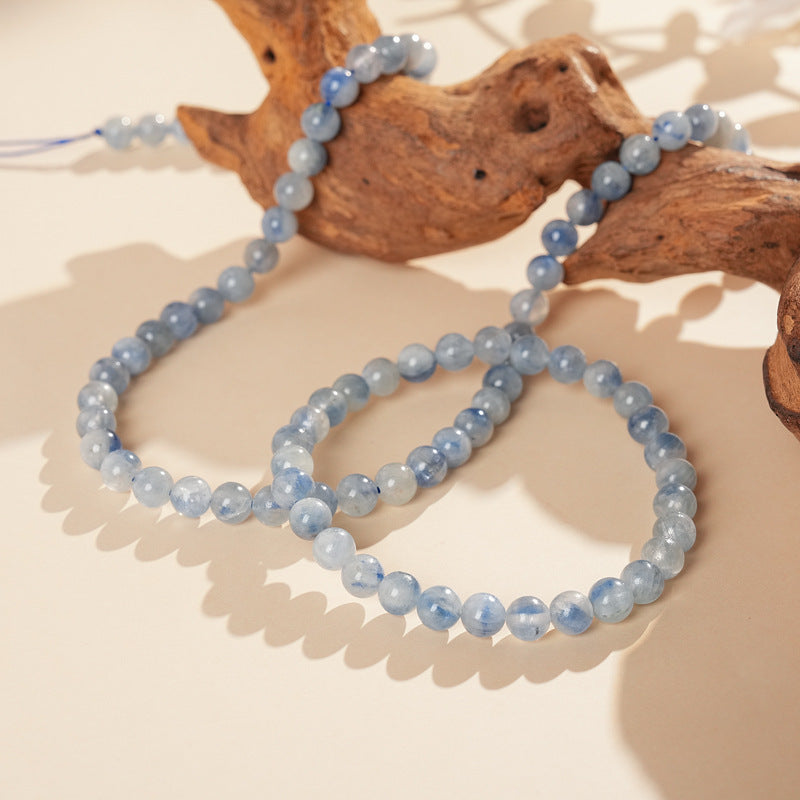Blue crystal beaded bracelet with gold-tone spacers, shown in 6 mm and 8 mm options — Indigo Mist Crystal Bracelet by Glazenya.
