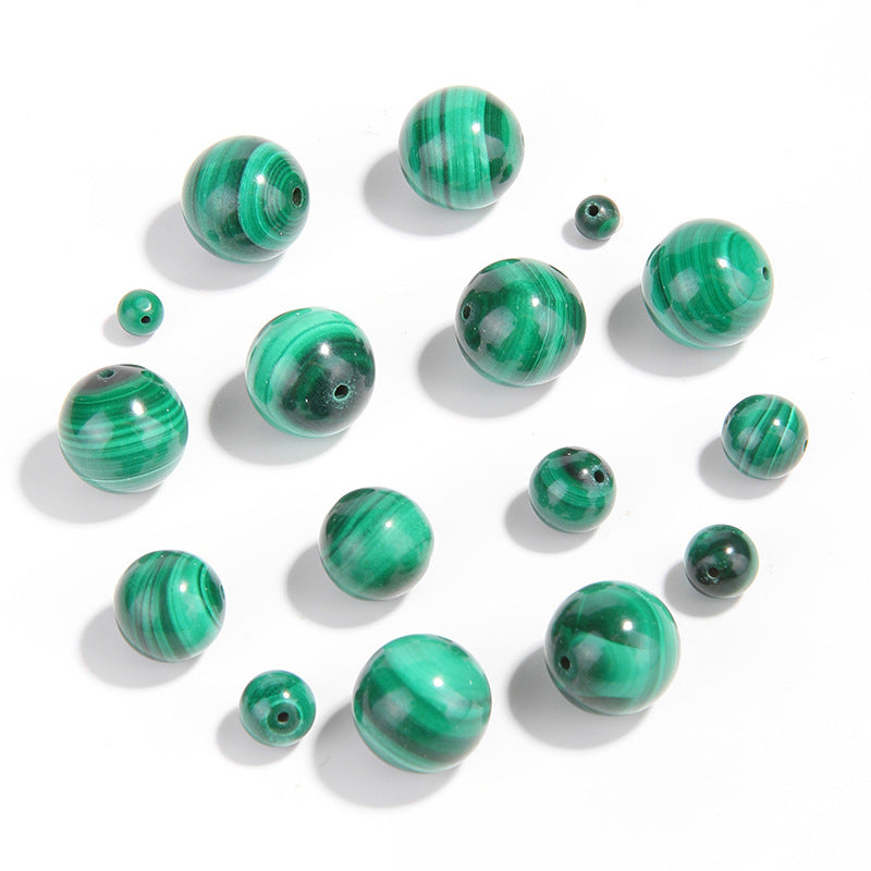 Malachite round beads with green banded “peacock” patterns, polished, assorted 4–12 mm — Peacock Veins.