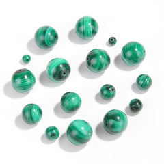 Malachite round beads with green banded “peacock” patterns, polished, assorted 4–12 mm — Peacock Veins.