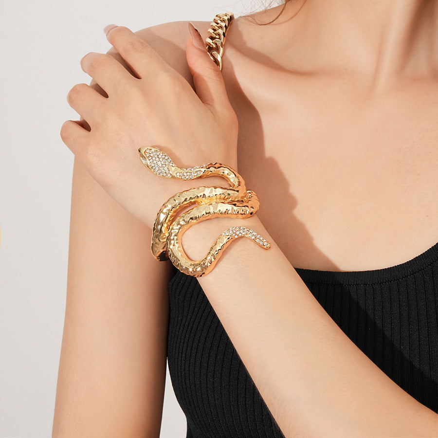 Serpent Luxe Cuff bracelet in gold and silver with rhinestone snake design