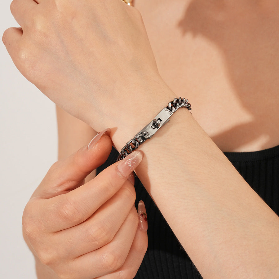 LockChain Minimalist Bracelet in silver, gold, and black metal chain with lock clasp design, displayed on wrist