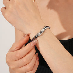LockChain Minimalist Bracelet in silver, gold, and black metal chain with lock clasp design, displayed on wrist