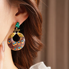 Statement earrings with peacock feather hoop design and emerald stud – Peacock Glory Statement Earrings.