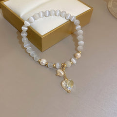 Multi-style cat’s eye and pearl bracelet collection – chic women’s accessories