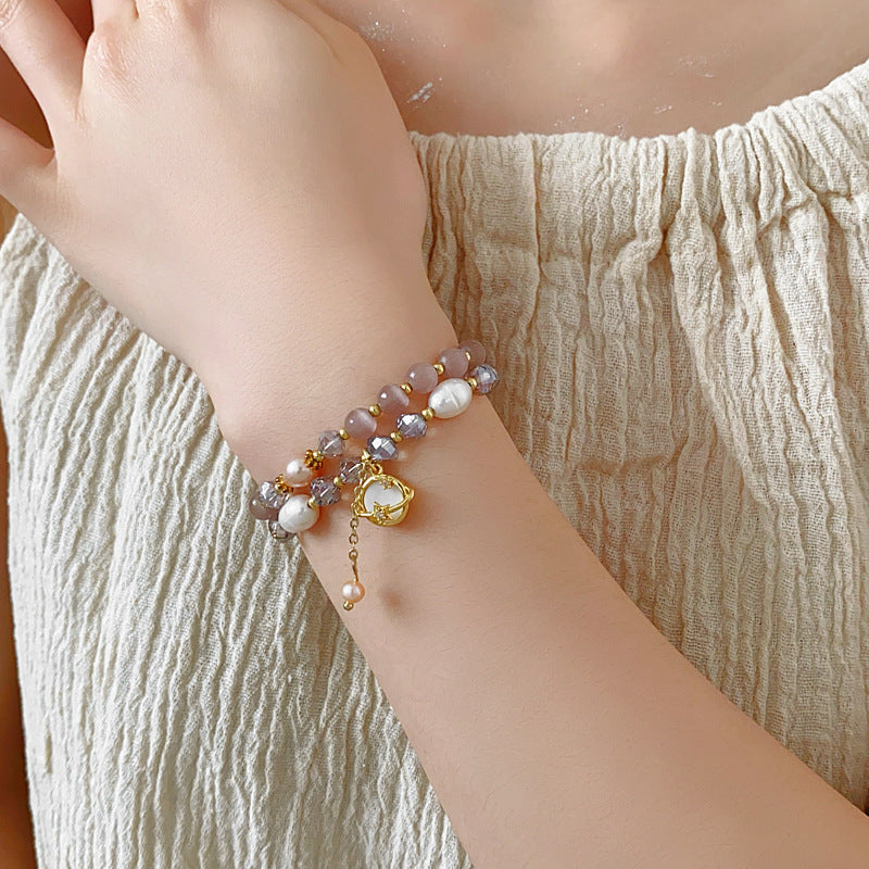 Celestial Cat’s Eye Bracelet double strand with cat’s-eye stones, freshwater pearls, crystal beads and gold planet charm