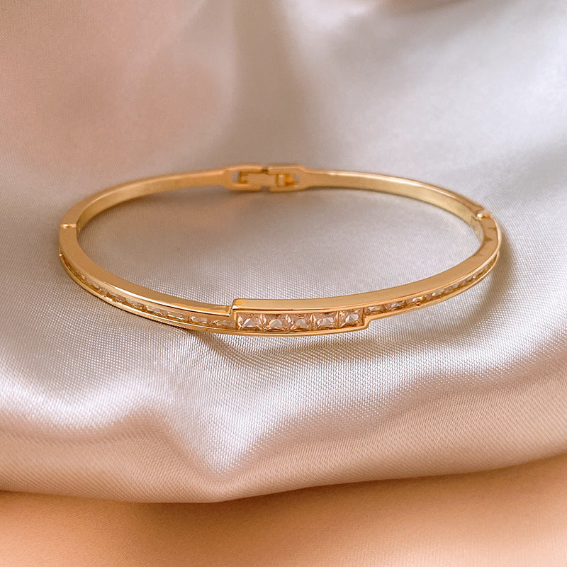 Linea Crystal Channel Bangle in gold tone with channel-set crystals – Glazenya