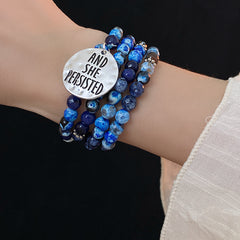Multi-wrap blue agate bracelet with “AND SHE PERSISTED” charm — Ocean Resolve Bracelet by Glazenya.