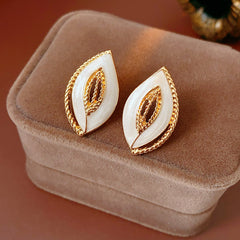 Leaf-shaped stud earrings with gold outline and white enamel – Golden Leaf Elegance Stud Earrings.