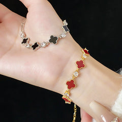 Red enamel clover bracelet with zircon accents and gold tone chain – Glazenya