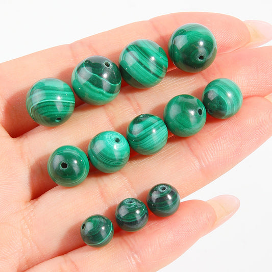 Malachite round beads with green banded “peacock” patterns, polished, assorted 4–12 mm — Peacock Veins.