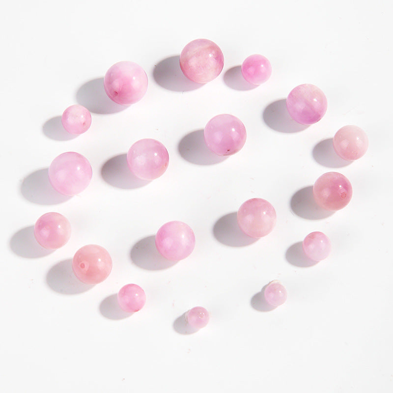 Pink-lilac kunzite round beads with silky glow, assorted 6–13 mm — Sakura Haze.