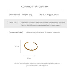 Elegant open bangle in gold with sparkling zircon stones and a marquise centerpiece, light-luxury adjustable bracelet.